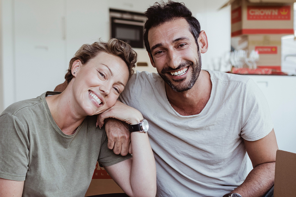 happy couple smiling ready to relocate