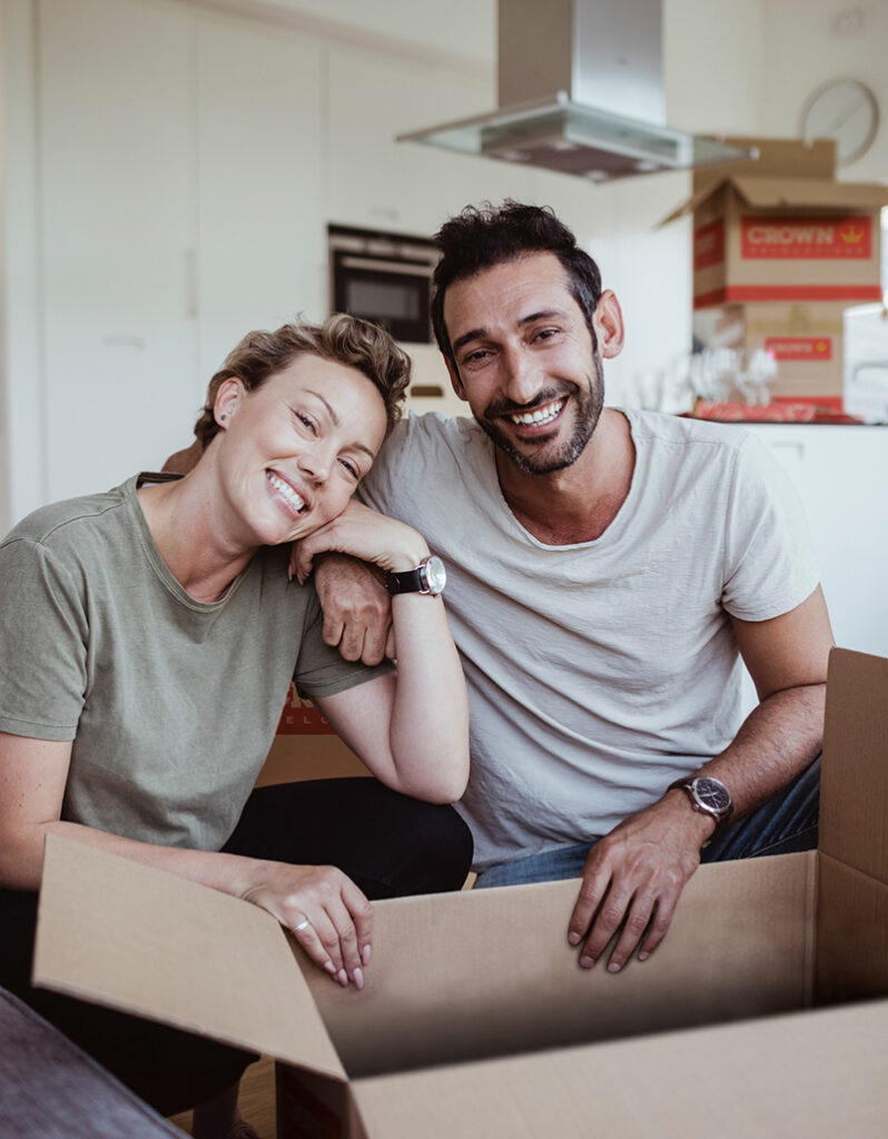 happy couple smiling ready to relocate