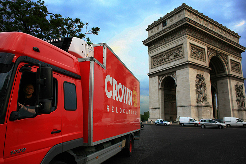 Crown Relocation 1220 truck at Arc de triomphe Paris city at day