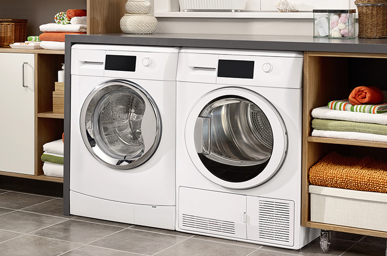 Domestic laundry room with washing machine and dryer