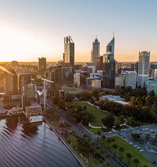 The golden, warm sunlight is illuminating the CBD of Perth city.