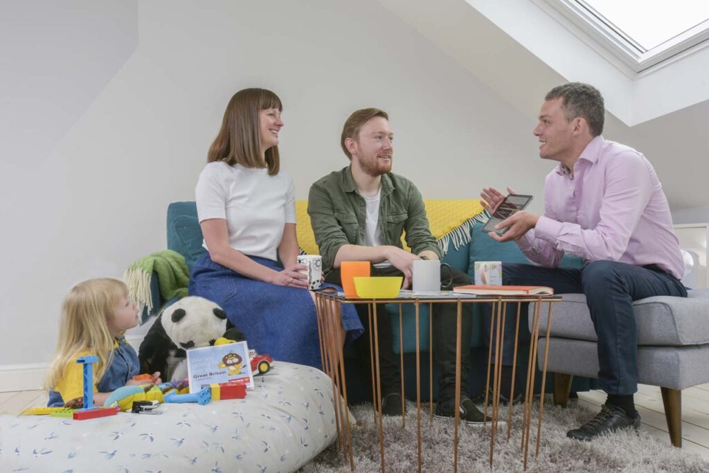 Couple chatting with a moving consultant
