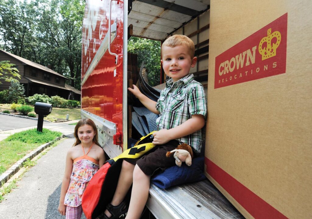 Children sitting in moving van.